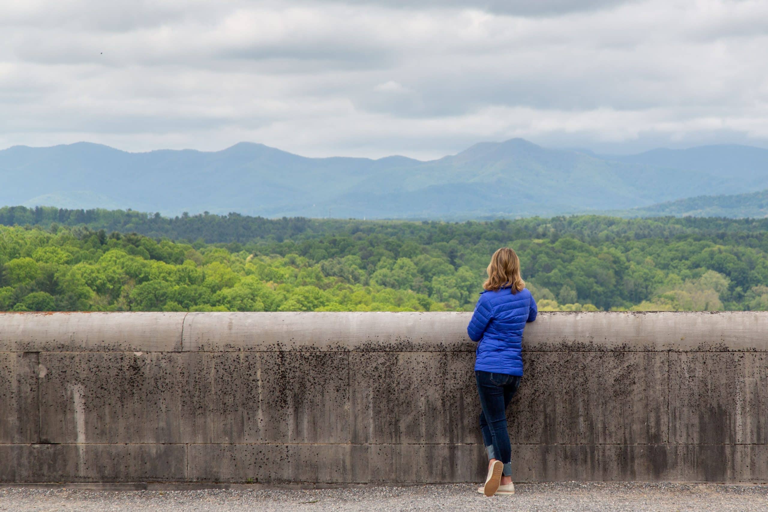 Samantha Brown enjoying the lookout and view of the Blue Ridge Mountains in Asheville North Carolina